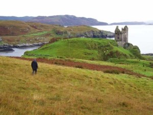 Romantic image of a ruined castle on a rugged coast.